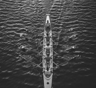 people riding boat on body of water